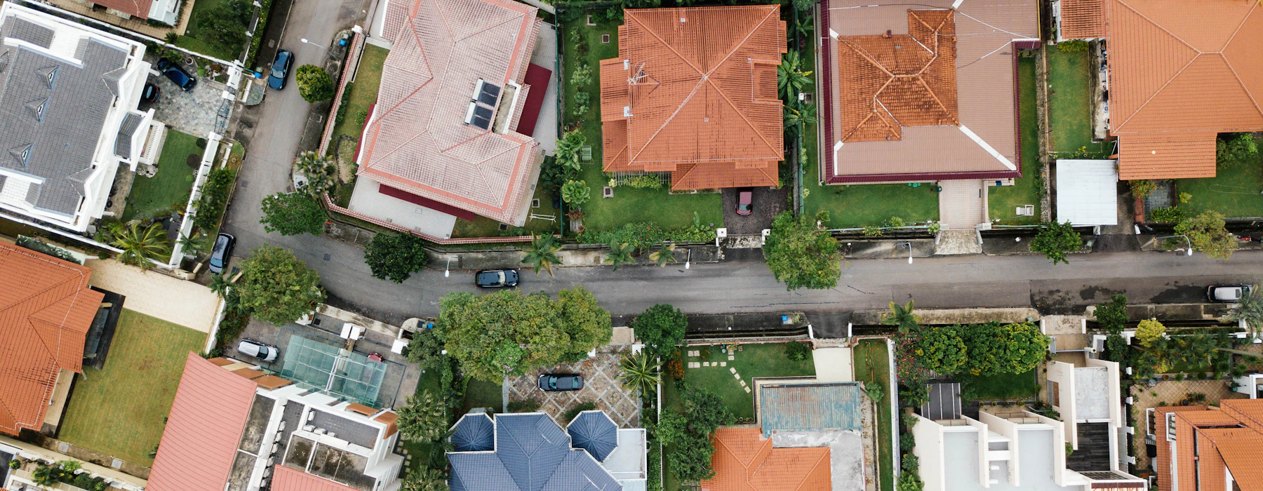 A residential neighborhood of homes and tree-lined streets